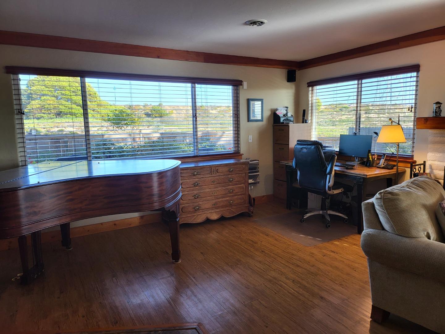 1753 Juarez Street Seaside, CA 93955 - Photo 11 of 52 a living room filled with furniture and a large window