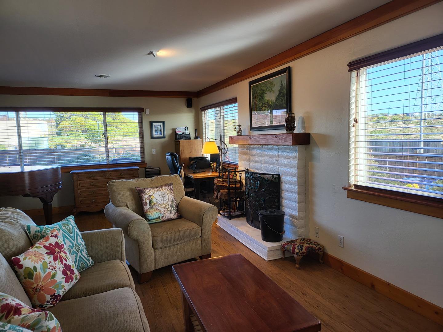 1753 Juarez Street Seaside, CA 93955 - Photo 13 of 52 a living room with furniture and a fireplace