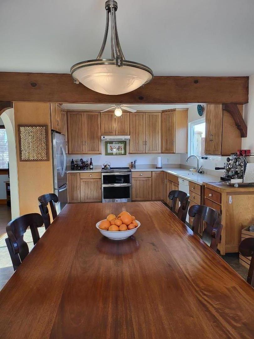 1753 Juarez Street Seaside, CA 93955 - Photo 18 of 52 a view of a dining room with furniture a chandelier and wooden floor