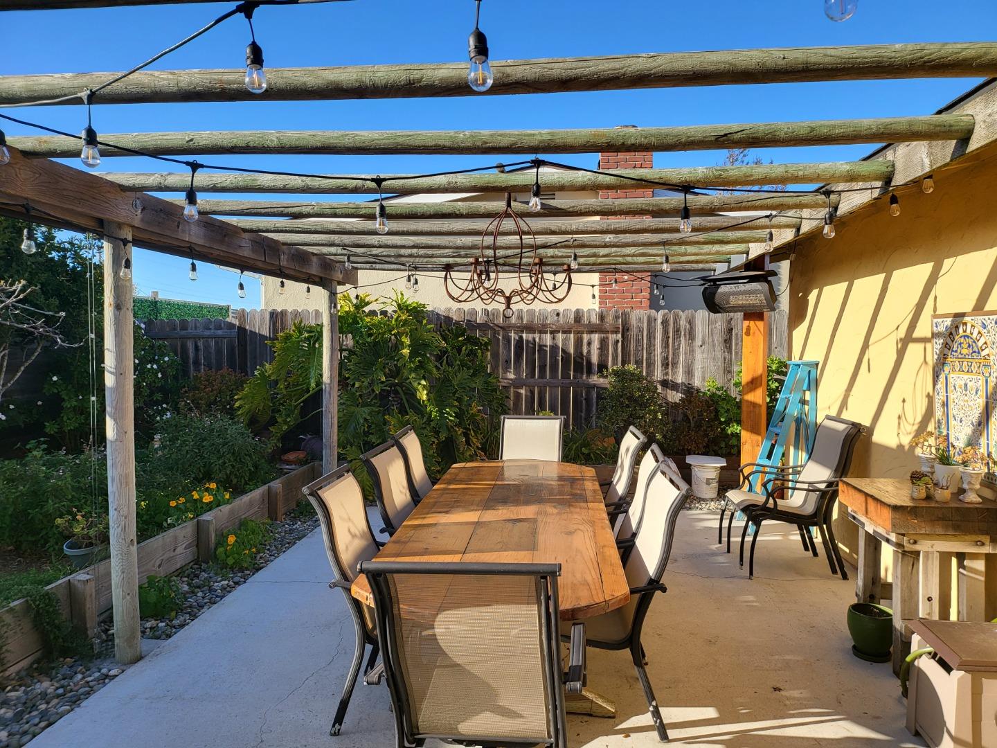 1753 Juarez Street Seaside, CA 93955 - Photo 24 of 52 a view of patio with table and chairs potted plants with floor to ceiling window and potted plants