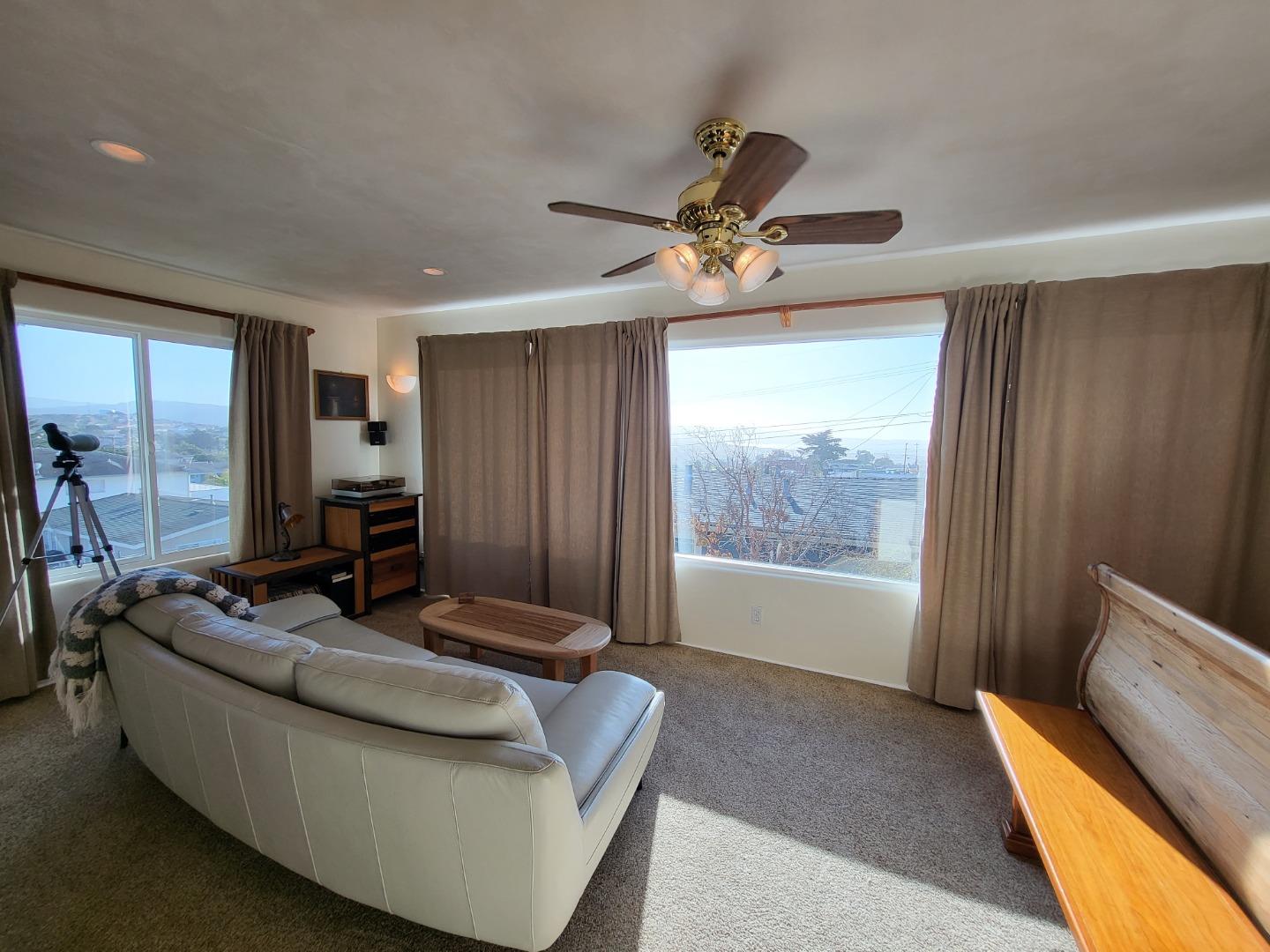 1753 Juarez Street Seaside, CA 93955 - Photo 31 of 52 a living room with furniture and a floor to ceiling window