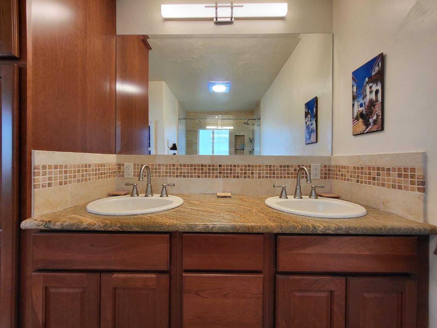1753 Juarez Street Seaside, CA 93955 - Photo 35 of 52 a bathroom with double vanity sinks and a mirror