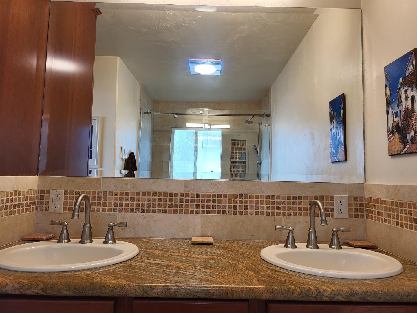 1753 Juarez Street Seaside, CA 93955 - Photo 37 of 52 a bathroom with a sink and a mirror