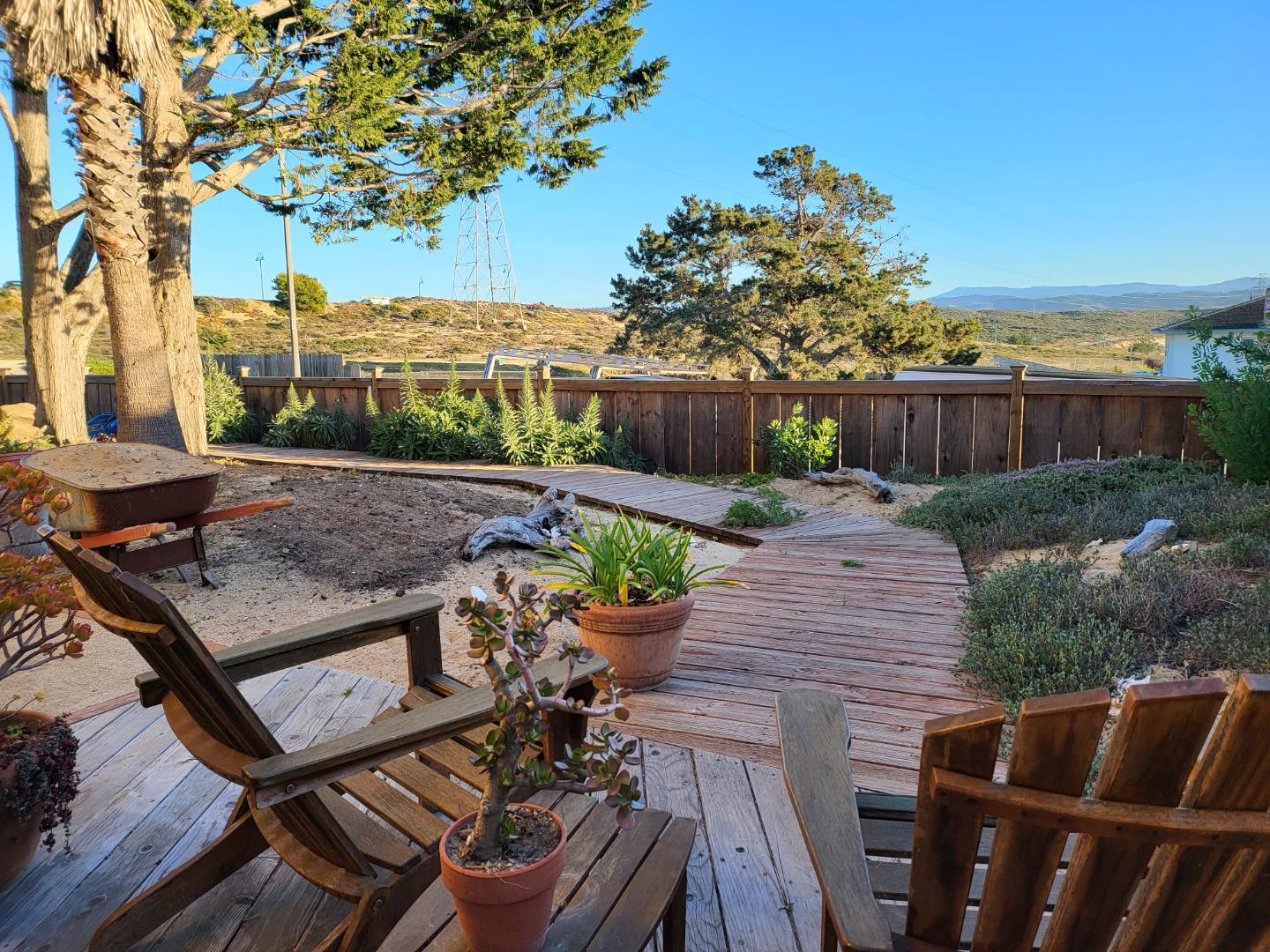 1753 Juarez Street Seaside, CA 93955 - Photo 42 of 52 a view of a chairs and table on the wooden deck