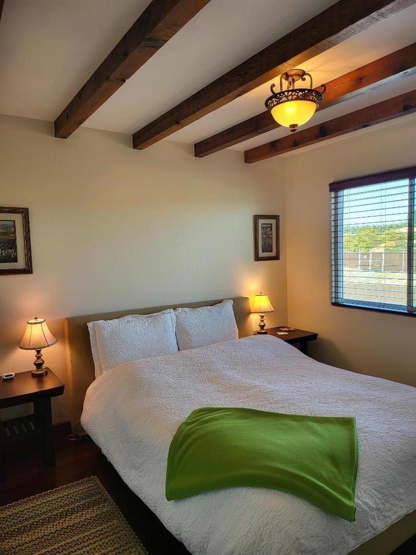 1753 Juarez Street Seaside, CA 93955 - Photo 43 of 52 a bedroom with a bed and lamps