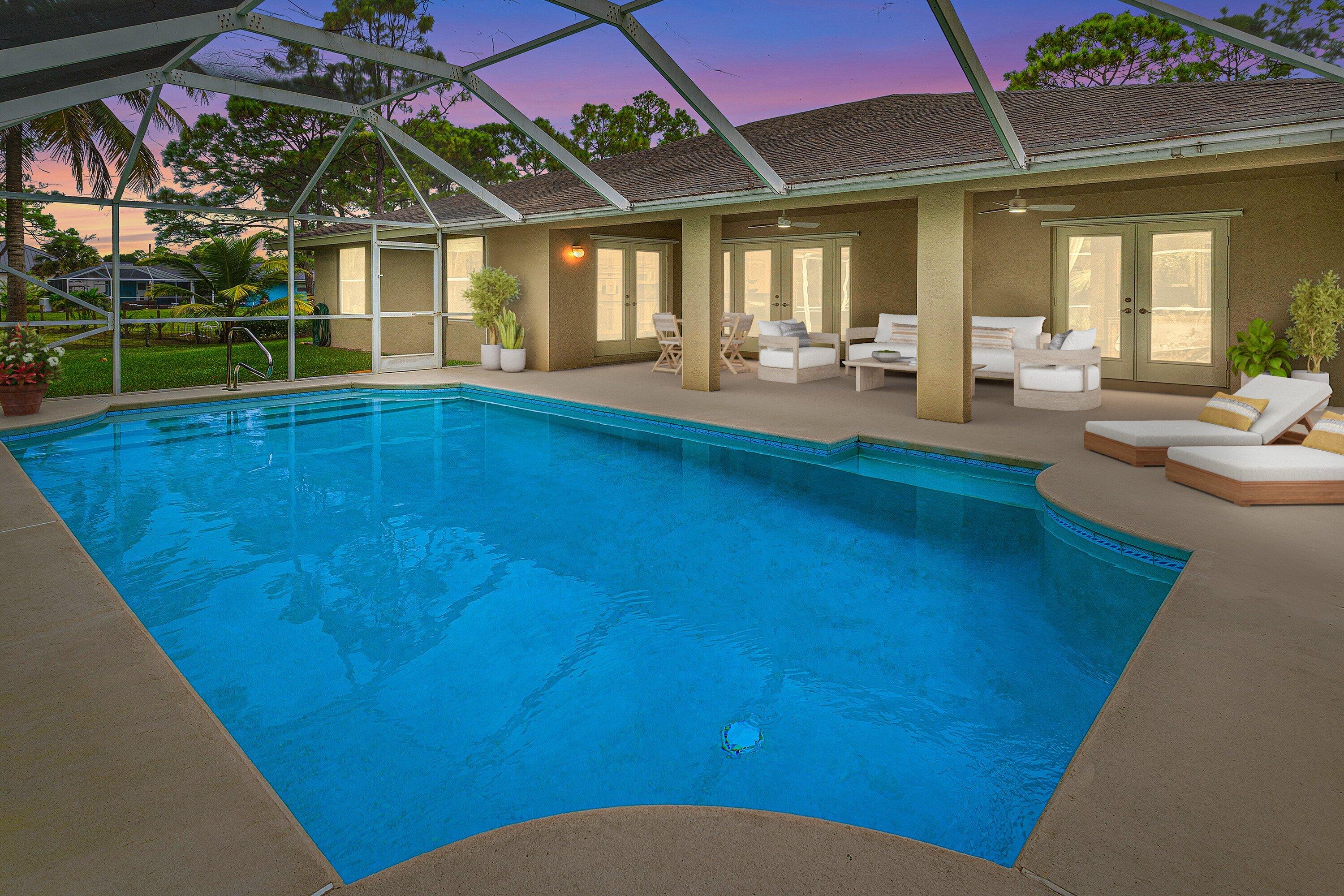 a view of swimming pool with seating space