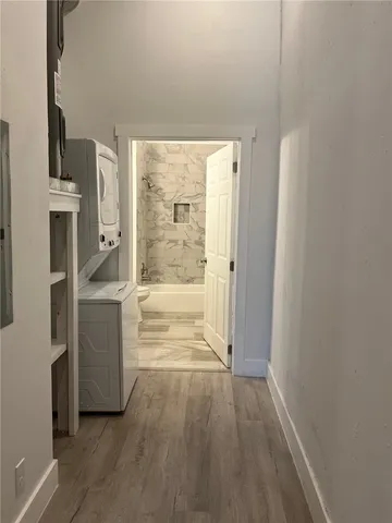 a view of a kitchen with a refrigerator a stove top oven