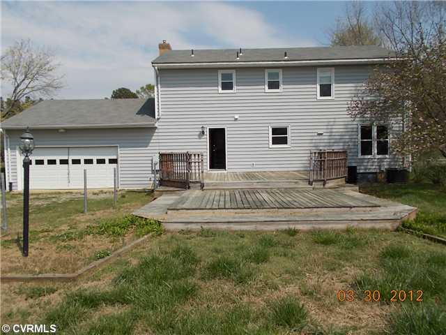8300 Recreation Road Henrico, VA 23231 - Photo 10 of 12 Exterior Back - Rear of house with large extended deck and two car garage.