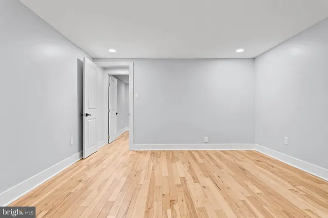 a view of room with wooden floor