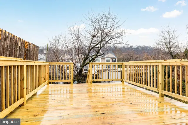 a view of swimming pool with trees in the background