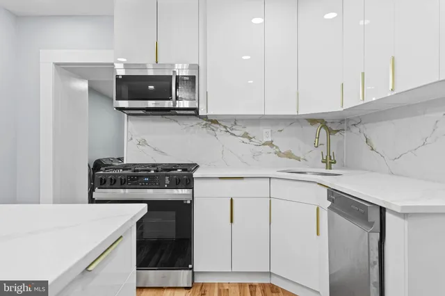 a kitchen with a stove and a microwave