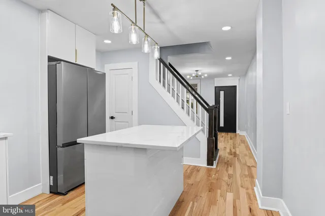 a view of entryway with stairs and wooden floor