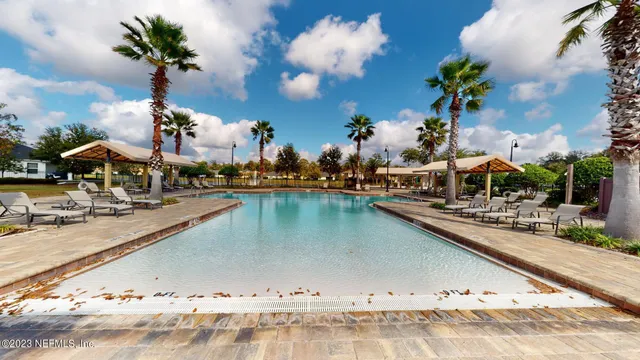 a view of a swimming pool with a deck