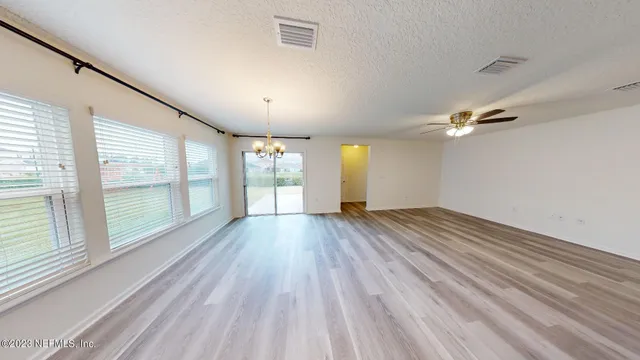 a view of a hallway with stairs