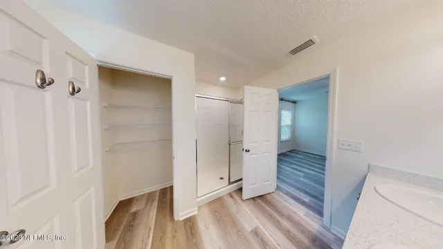a bathroom with a sink double vanity and a mirror