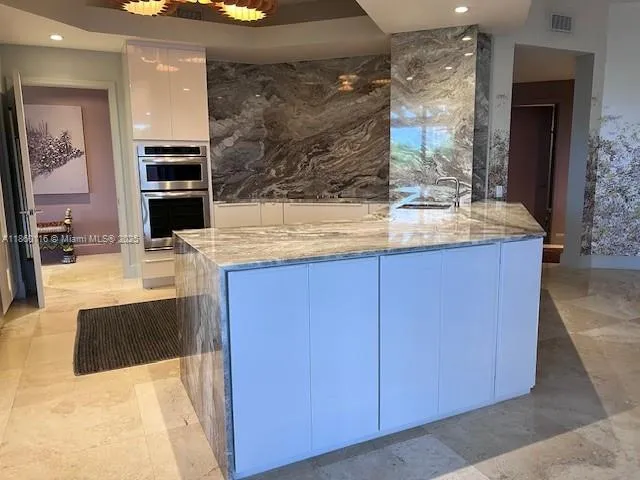 a kitchen with a stove and a microwave