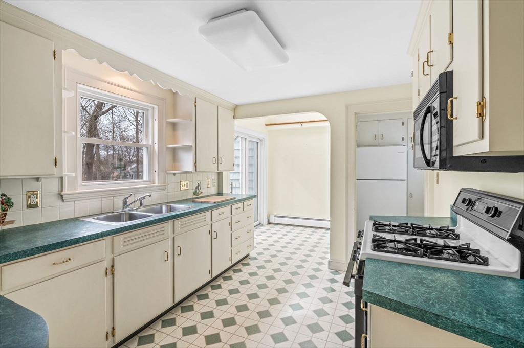 5 Prospect Street Danvers, MA 01923 - Photo 12 of 42 a kitchen with sink cabinets and appliances