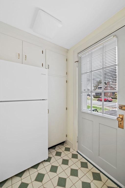 5 Prospect Street Danvers, MA 01923 - Photo 15 of 42 a room with a refrigerator and a window