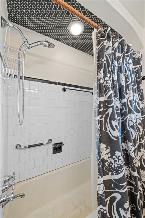 5 Prospect Street Danvers, MA 01923 - Photo 17 of 42 a bathroom with a bathtub and a shower