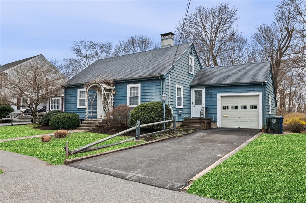 5 Prospect Street Danvers, MA 01923 - Photo 2 of 42 a front view of a house with a yard and garage
