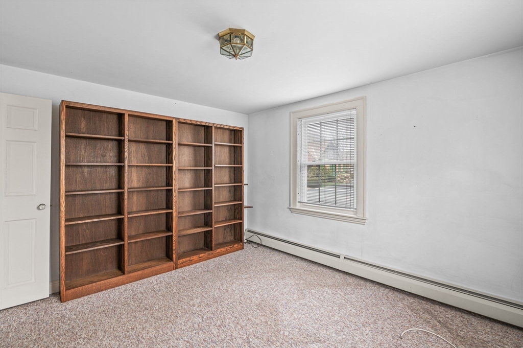 5 Prospect Street Danvers, MA 01923 - Photo 21 of 42 a view of an empty room with a window and closet