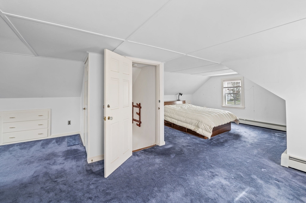5 Prospect Street Danvers, MA 01923 - Photo 22 of 42 a spacious bedroom with a bed and a cabinets