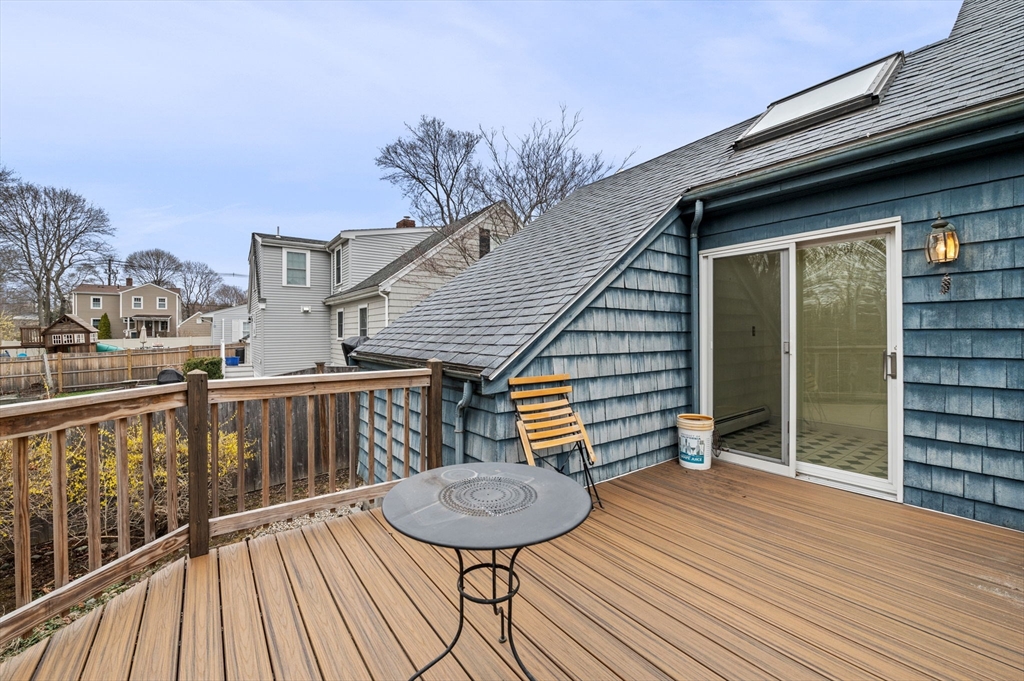 5 Prospect Street Danvers, MA 01923 - Photo 28 of 42 a balcony view with two chairs and a potted plant on it