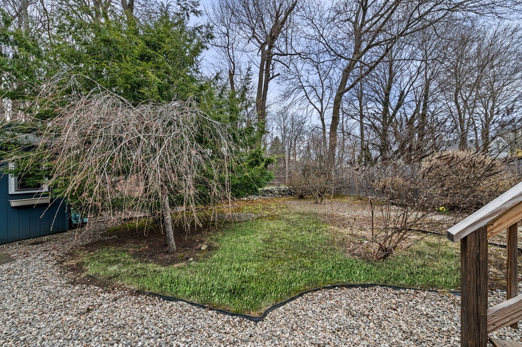 5 Prospect Street Danvers, MA 01923 - Photo 31 of 42 a view of a backyard with large trees