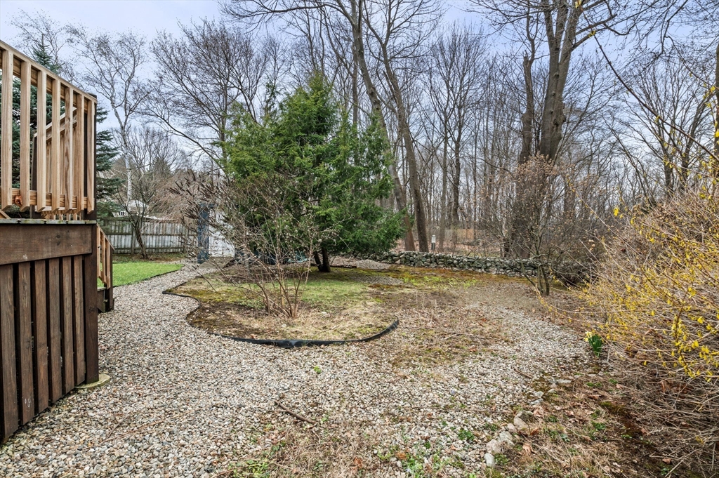 5 Prospect Street Danvers, MA 01923 - Photo 34 of 42 a view of a backyard with large trees