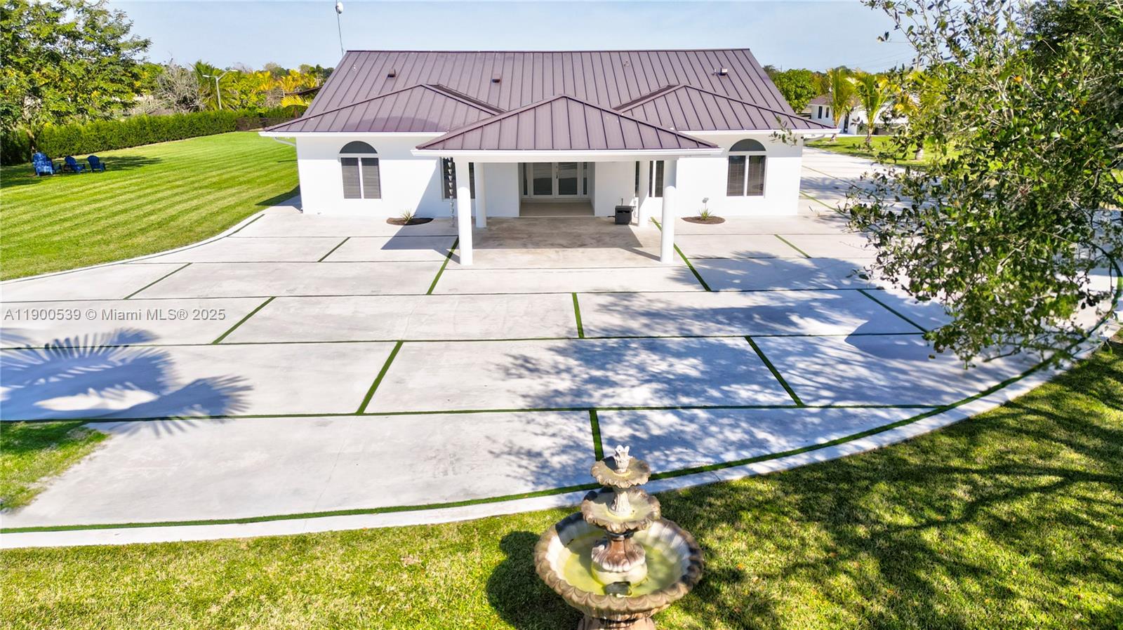 20407 Southwest 226th Street Miami, FL 33170 - Photo 13 of 71 a front view of a house with garden