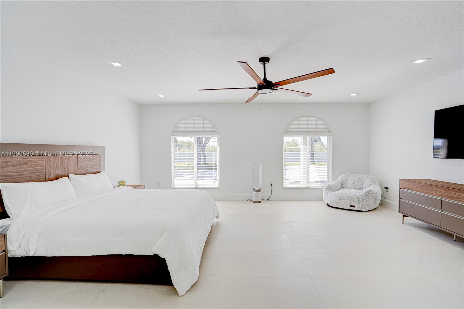 20407 Southwest 226th Street Miami, FL 33170 - Photo 33 of 71 a bedroom with a bed and ceiling fan
