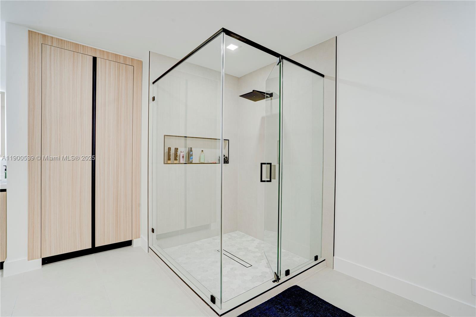 20407 Southwest 226th Street Miami, FL 33170 - Photo 47 of 71 a bathroom with a shower and a glass door