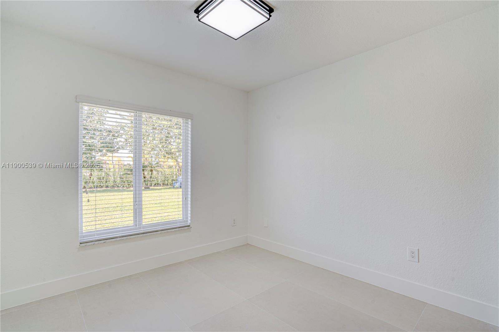 20407 Southwest 226th Street Miami, FL 33170 - Photo 54 of 71 an empty room with a window