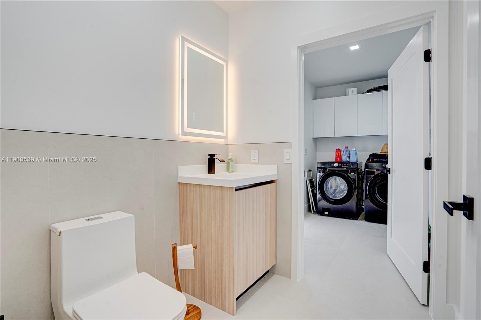 20407 Southwest 226th Street Miami, FL 33170 - Photo 58 of 71 a utility room with sink dryer and washer