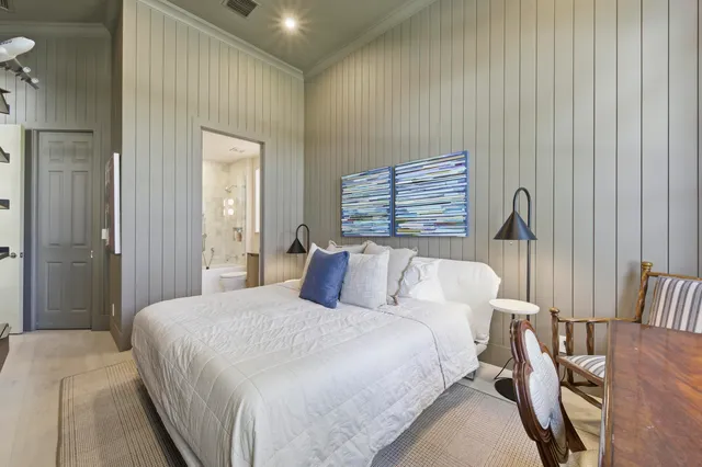 a bedroom with a bed and a table