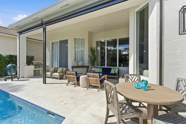 a outdoor space with patio the couches and a dining table with garden view