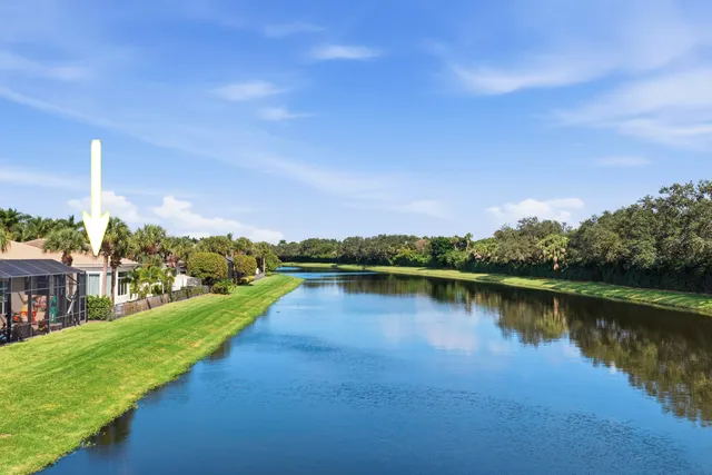 a view of a lake with houses in the back