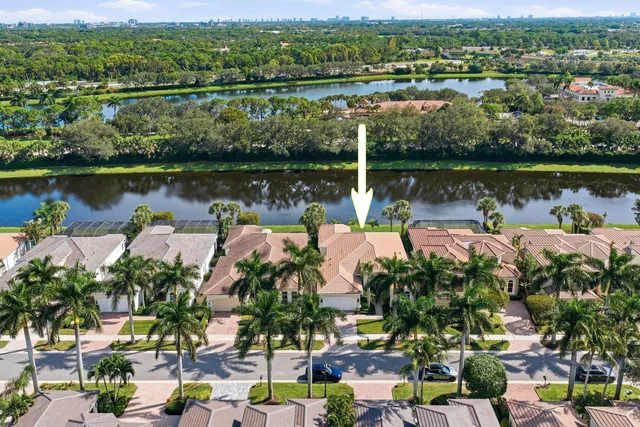 an aerial view of a house with a lake view