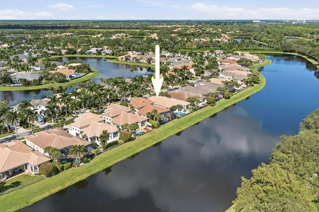 an aerial view of a city with lake view