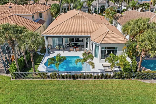 a view of house with outdoor seating and yard
