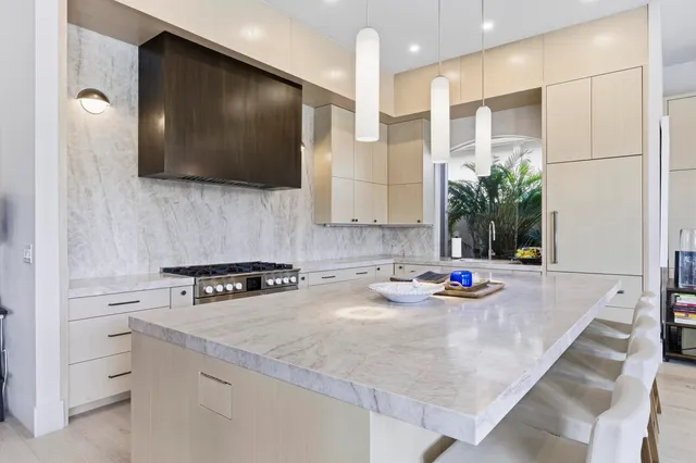 a kitchen with sink stove and microwave