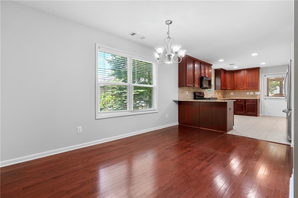 3159 Robinson Avenue Scottdale, GA 30079 - Photo 12 of 45 a view of a kitchen with a sink cabinets and wooden floor