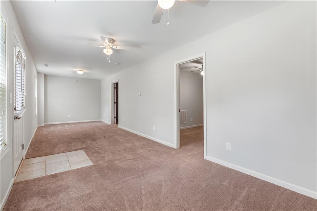 3159 Robinson Avenue Scottdale, GA 30079 - Photo 28 of 45 an empty room with fan and entrance