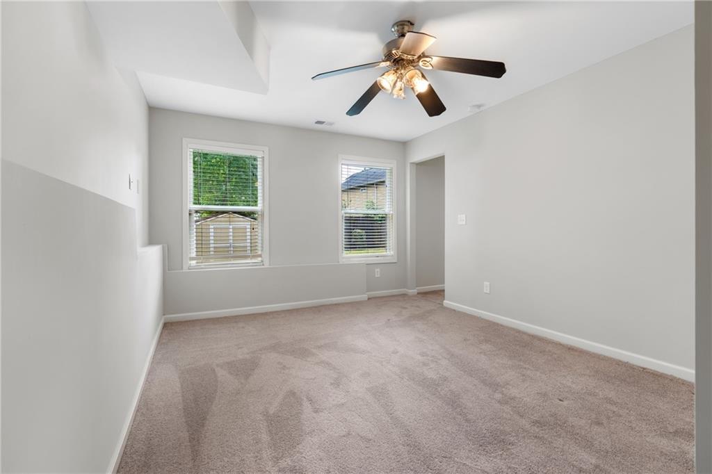 3159 Robinson Avenue Scottdale, GA 30079 - Photo 30 of 45 an empty room with windows and fan
