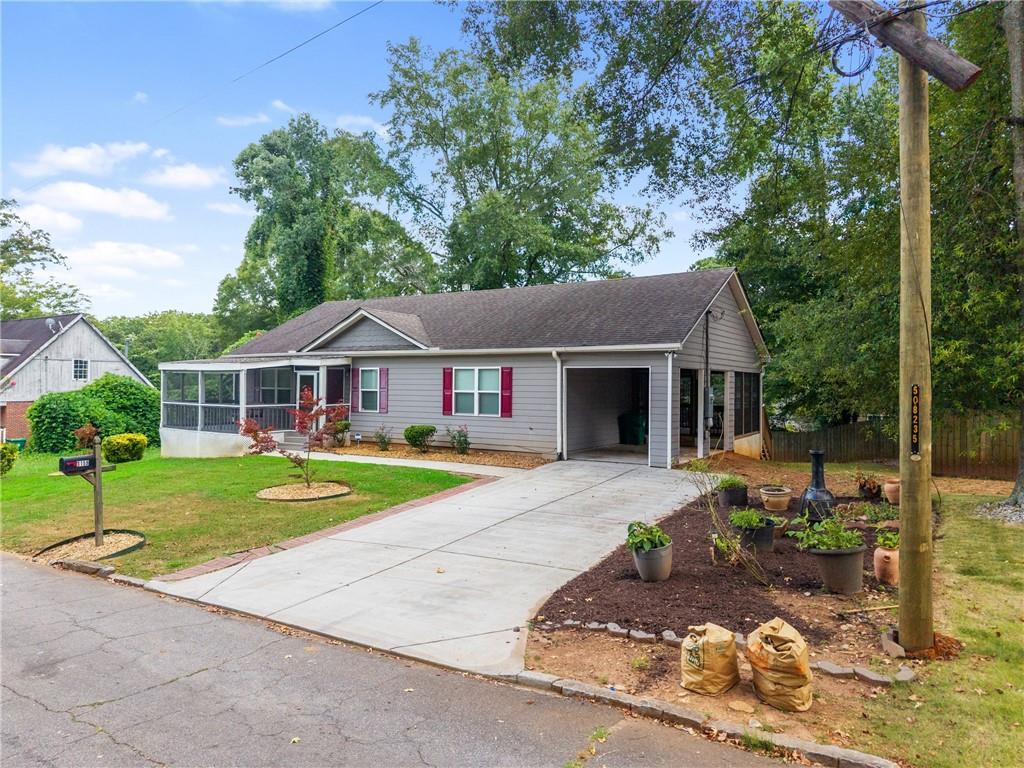 3159 Robinson Avenue Scottdale, GA 30079 - Photo 3 of 45 a front view of a house with garden