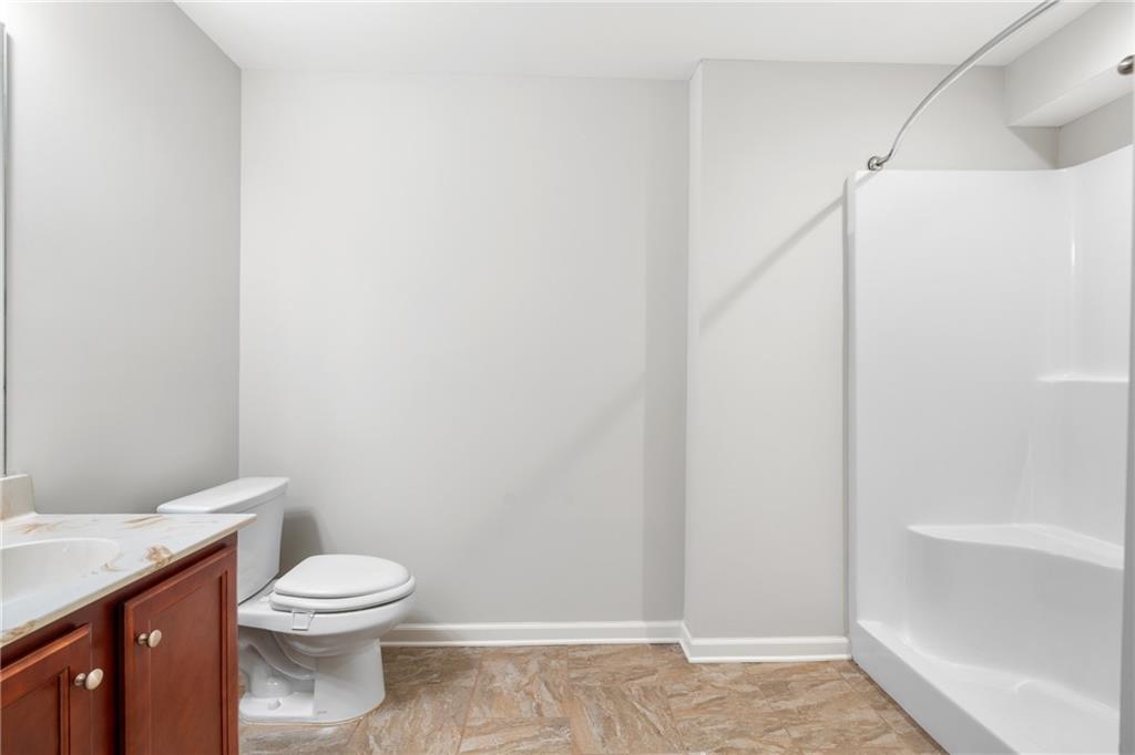 3159 Robinson Avenue Scottdale, GA 30079 - Photo 31 of 45 a white toilet sitting next to a shower