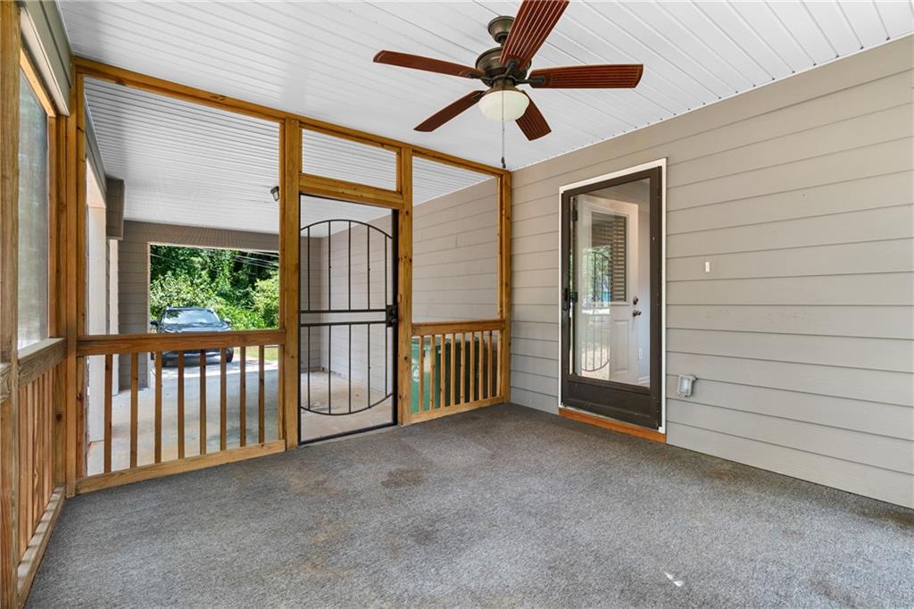 3159 Robinson Avenue Scottdale, GA 30079 - Photo 38 of 45 a view of a porch with wooden floor and a ceiling fan