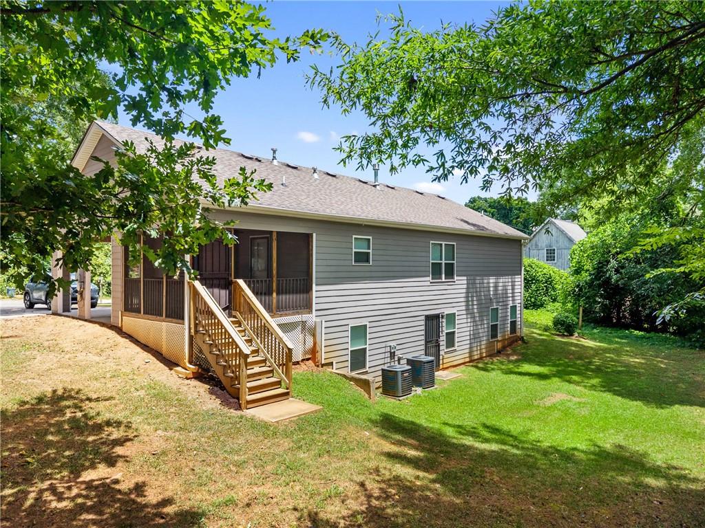 3159 Robinson Avenue Scottdale, GA 30079 - Photo 41 of 45 a view of a house with a yard and large tree
