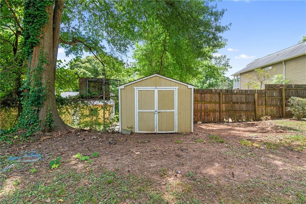 3159 Robinson Avenue Scottdale, GA 30079 - Photo 44 of 45 a front view of a house with a garden and trees