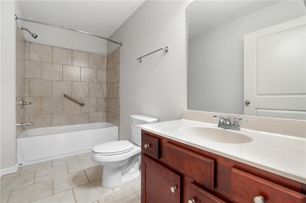 3159 Robinson Avenue Scottdale, GA 30079 - Photo 10 of 45 a bathroom with a sink a toilet and a bathtub